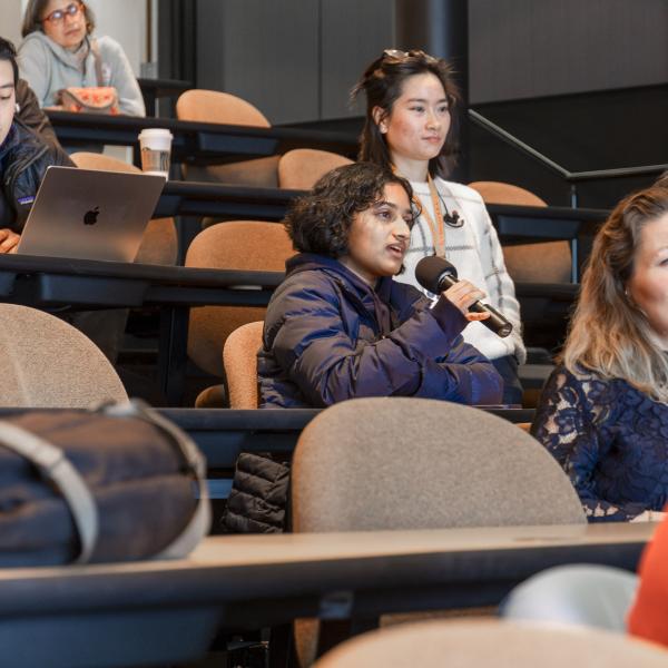 A public lecture audience member asks questions after Elizabeth Ryland's talk.