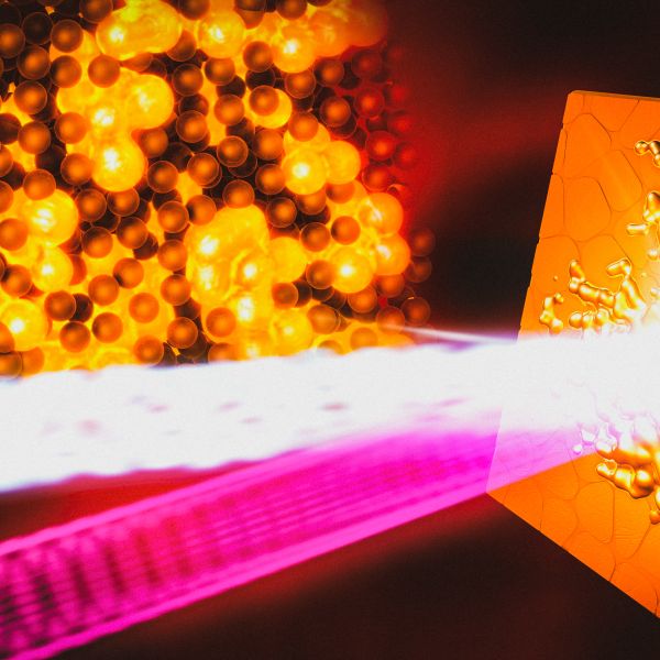 Bright white and pink beam of light striking an orange textured surface, with clustered glowing orange spheres on the left against a dark background.