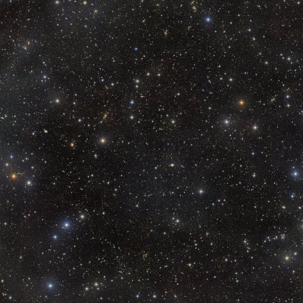 Field of night sky with stars and galaxies