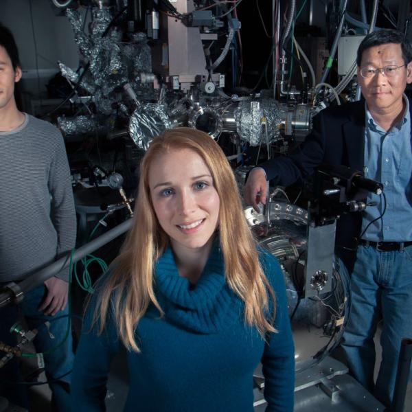 Photo - Scientists standing with equipment at SLAC.