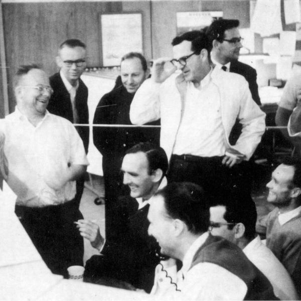 Photo - Archival photo of excited scientists in linac control room.