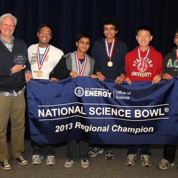 Photo - Group shot of students holding Science Bowl banner.