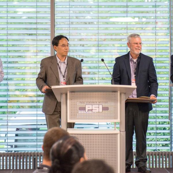 Image - From left, SLAC's Erik Hemsing, Zhirong Huang and William Fawley accept awards during the 36th International Free Electron Laser Conference in Basel, Switzerland. At right is SLAC's Paul Emma, who served as this year's FEL Prize committee chairman