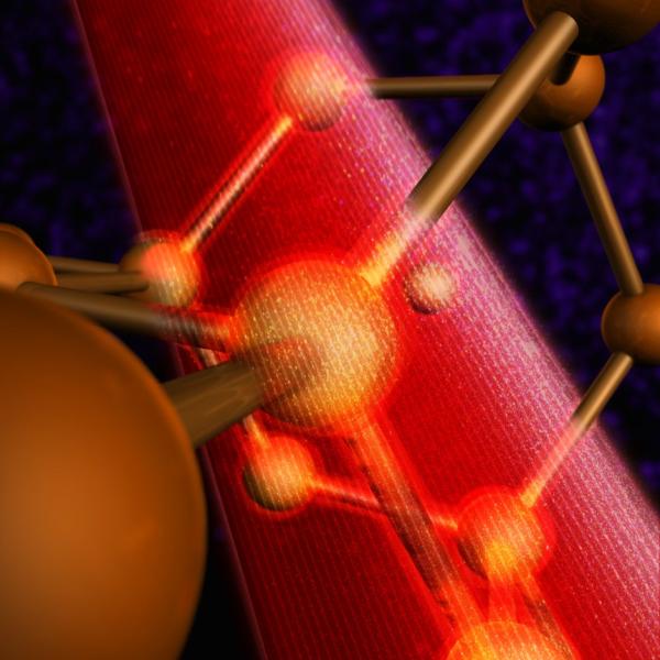 Image showing laser beam energizing atoms in crystal lattic