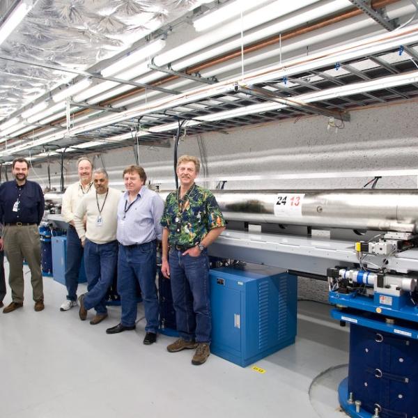 Image - Some of the LCLS team members stand by the newly installed undulators in this 2009 photo. From right: Mike Zurawel, Geoff Pile from Argonne National Laboratory, Paul Emma, Dave Schultz, Heinz-Dieter Nuhn and Don Schafer. (Brad Plummer) 