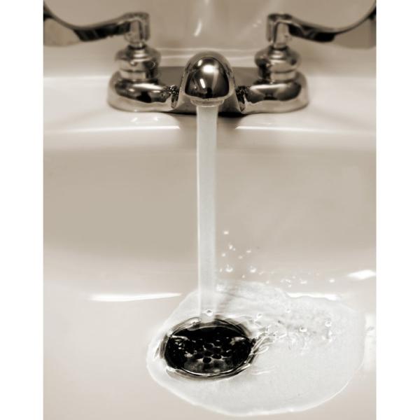 Image of a sink with water flowing down the drain.