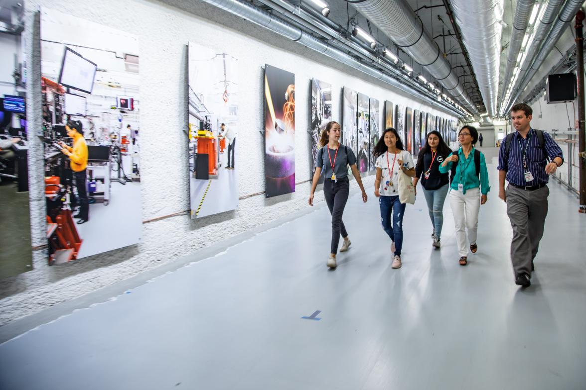 SAGE Students walking down the Far Experimental Hall