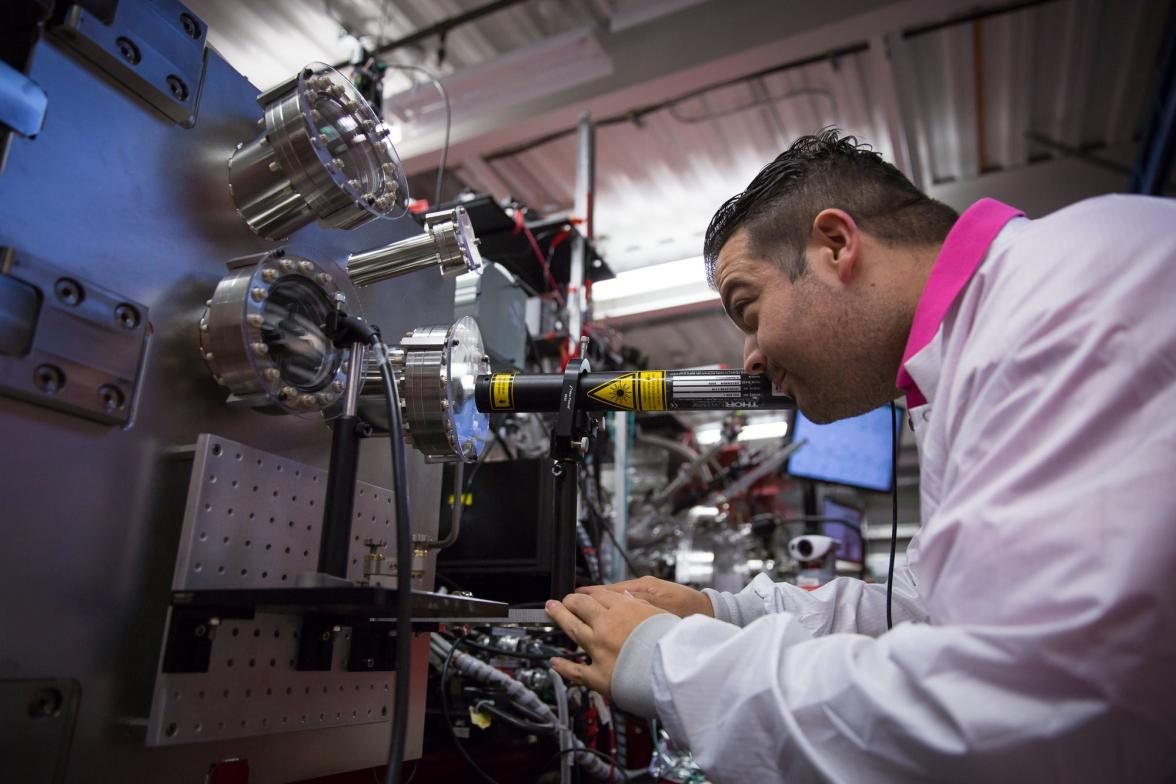 Raymond Sierra aligning key components of the imaging setup used at the Coherent X-ray Imaging (CXI) experimental station.