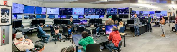 Visitors to SLAC tour the accelerator control room during Community Day 2019