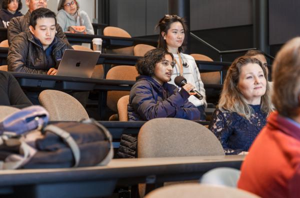 A public lecture audience member asks questions after Elizabeth Ryland's talk.
