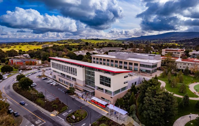 The SLAC main entrance from Sand Hill Road. Science and User Support Building (SUSB) with Stanford Guest house to the left. 
