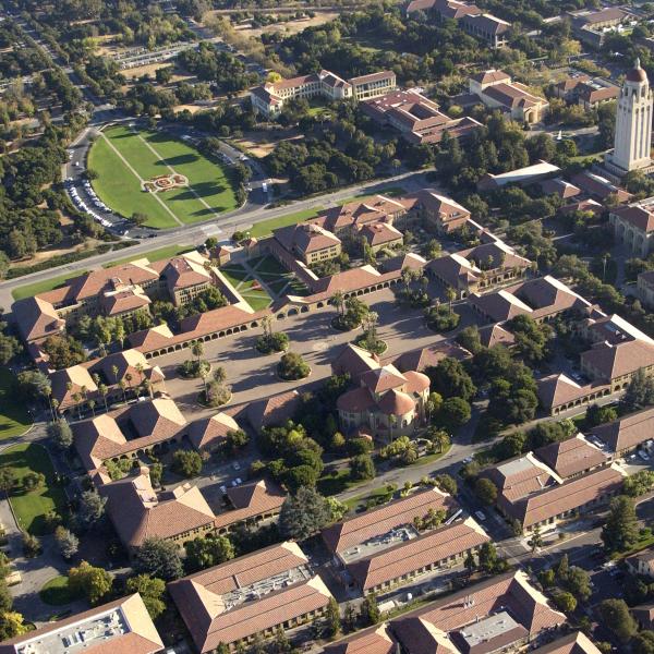 Aerial of Stanford University including the Oval, Quad, and Hoover Tower.