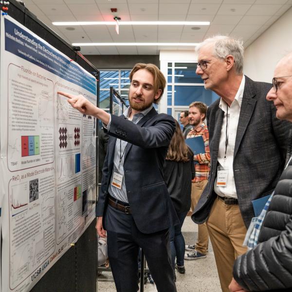  Participants discuss their scientific posters during the 2019 Bay Area Battery Summit.